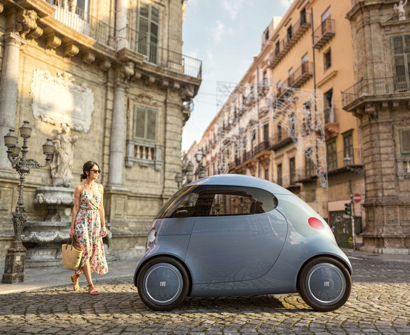 Woman in floral dress walking beside blue Fiat Topolino XS concept